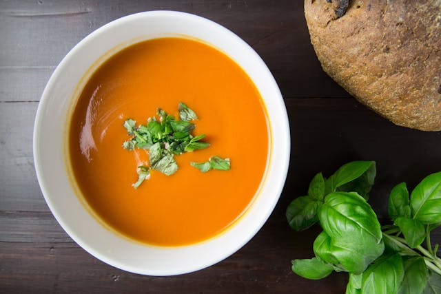 A diet of warm foods like a bowl of pumpkin soup with sprig of fresh basil can affect and improve sleep in some people